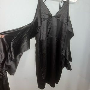 Lulus black bodycon dress. Cold shoulder sleeve with ruffled open sleeves